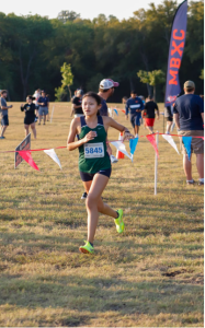 Linda Zhang running at a Cross Country meet this year. This year's Cross Country team made it to UIL state. 